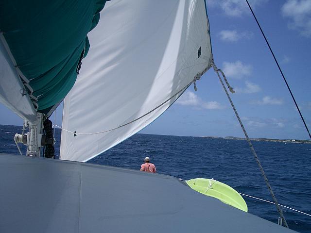 I'm sitting on the bow as we're sailng around the coast.