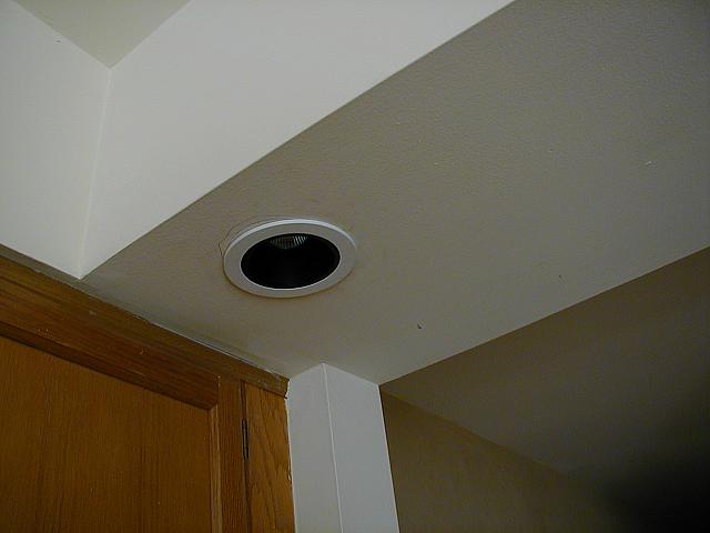 A pair of low-voltage lights are installed over the sink.