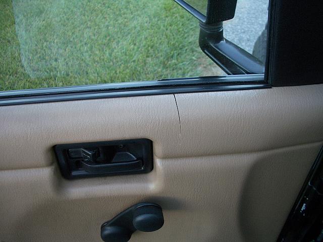 Small crack in the drivers door panel.