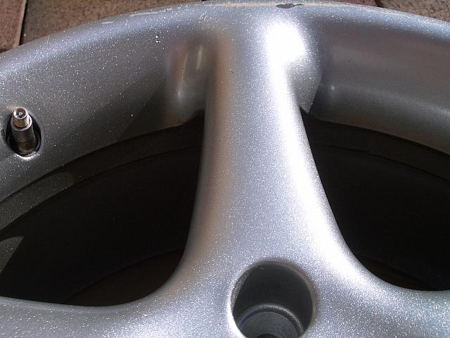 Closeup of the rustoleum.  I didn't prep the wheel any.  That's not pitting, it's metal flake.