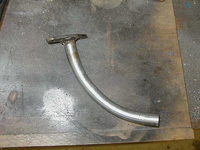 Bent a piece of eletrical conduit and welded it on.