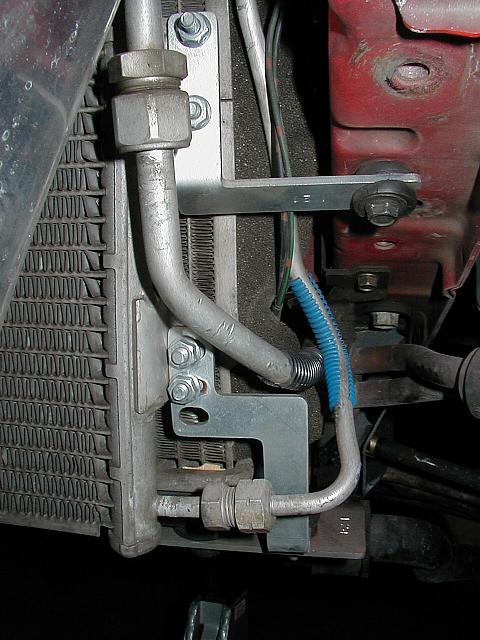 Here you can see both drivers side AC condensor mounts.  The bottom attaches to the radiator mount plates, supplied by Blitz.