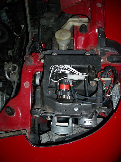 The Igniter is mounted to the right of the bucket.  The ballast is mounted on the car to the right of the assembly.